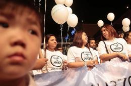 马来西亚各界人士为失联航班MH370祈福