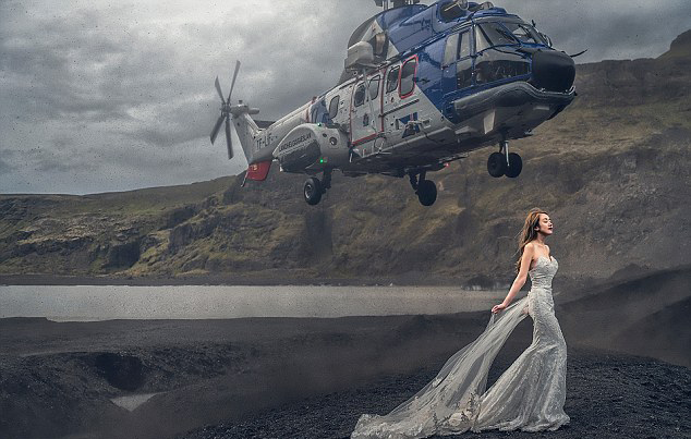 夫妇为拍完美婚纱照让直升机悬新娘头顶