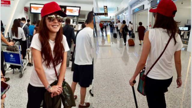 张柏芝拄拐杖现身机场一路蹒跚