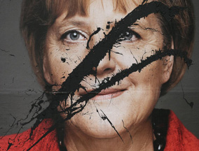 德国总理默克尔竞选照片遭恶意毁坏